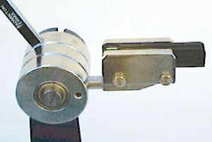 Linear ball bearing string gripper with spring clutch (ratchet)